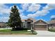 Charming single-story home with a well-manicured lawn and attached two-car garage at 2752 Bellewater Pl, Oviedo, FL 32765