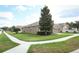 Well-maintained home with manicured lawn, showcasing the clean landscaping and serene neighborhood setting at 2752 Bellewater Pl, Oviedo, FL 32765