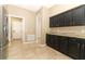 Cozy kitchen with stainless steel appliances, granite countertops and tile flooring at 2752 Bellewater Pl, Oviedo, FL 32765