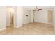 Open living space with tile flooring, neutral walls and several doorways at 2752 Bellewater Pl, Oviedo, FL 32765