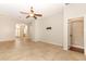 Spacious living area with tile floors leading to the front door and another room at 2752 Bellewater Pl, Oviedo, FL 32765