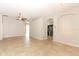 Large living area with open floor plan, tile floors and views into the kitchen at 2752 Bellewater Pl, Oviedo, FL 32765