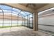Covered patio area featuring brick pavers and screen enclosure, leading to the backyard at 2752 Bellewater Pl, Oviedo, FL 32765