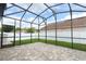 Screened-in patio with brick pavers and lawn, providing an enclosed outdoor space at 2752 Bellewater Pl, Oviedo, FL 32765