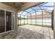 Covered patio area featuring brick pavers and screen enclosure for pest free outdoor enjoyment at 2752 Bellewater Pl, Oviedo, FL 32765