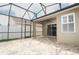 Covered patio with brick pavers, screened-in enclosure, and view to the backyard at 2752 Bellewater Pl, Oviedo, FL 32765