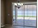 Covered outdoor patio with brick flooring, accessible through sliding glass doors at 2752 Bellewater Pl, Oviedo, FL 32765