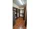 Spacious walk-in closet with custom shelving and wood flooring at 2752 Bellewater Pl, Oviedo, FL 32765