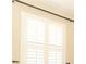 Close up detail of plantation shutters covering a window offering privacy and light control at 2752 Bellewater Pl, Oviedo, FL 32765