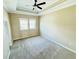Spacious bedroom featuring a tray ceiling with fan and two windows offering ample natural light at 276 Celebration Blvd, Celebration, FL 34747