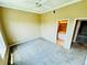 Bright bedroom with a ceiling fan, carpet, and an ensuite bathroom entrance at 276 Celebration Blvd, Celebration, FL 34747