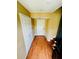 Inviting entryway with wood-look tile flooring, closet, and white front door at 276 Celebration Blvd, Celebration, FL 34747