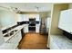 Well-lit kitchen featuring stainless steel appliances, granite counters, and a black tile backsplash at 276 Celebration Blvd, Celebration, FL 34747
