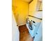 A laundry room with a modern washer and dryer set and ample storage cabinets at 276 Celebration Blvd, Celebration, FL 34747