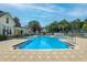 Community pool featuring sun loungers, umbrellas, and a gazebo for relaxing at 276 Celebration Blvd, Celebration, FL 34747
