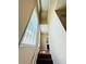 Stairway leading upstairs with wood steps, light walls, and tall windows that bring in lots of light at 276 Celebration Blvd, Celebration, FL 34747