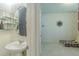 Half-bathroom with white sink and a tiled floor at 2783 Red Horse Dr, Kissimmee, FL 34744