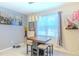 Dining area with stylish lighting, a small wine rack, and natural light at 2783 Red Horse Dr, Kissimmee, FL 34744