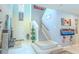 Entryway featuring high ceilings, stairway, and modern decor at 2783 Red Horse Dr, Kissimmee, FL 34744