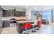 Kitchen with granite counters, stainless steel appliances, and seating at the island at 2783 Red Horse Dr, Kissimmee, FL 34744