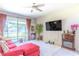 Comfortable living room featuring an electric fireplace and sliding glass doors at 2783 Red Horse Dr, Kissimmee, FL 34744