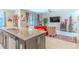 Bright living room open to kitchen with granite counter and comfortable seating at 2783 Red Horse Dr, Kissimmee, FL 34744
