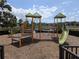 Vibrant community playground featuring slides, climbing structures, and a safety mulch surface at 2783 Red Horse Dr, Kissimmee, FL 34744