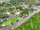Aerial view of homes with canals, lush landscaping, docks, and a serene waterfront setting at 28136 Tammi Dr, Tavares, FL 32778