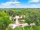 Aerial view of a beautiful home surrounded by lush greenery, highlighting its peaceful and private setting at 28136 Tammi Dr, Tavares, FL 32778