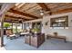 Comfortable covered porch with wooden ceiling, ceiling fans, and inviting seating area at 28136 Tammi Dr, Tavares, FL 32778