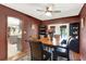Dining room boasting rich wall color, hardwood floors, and French doors offering natural light at 28136 Tammi Dr, Tavares, FL 32778