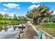 Waterfront property featuring a boat dock and swing by the canal, perfect for enjoying peaceful water views at 28136 Tammi Dr, Tavares, FL 32778