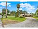 Well-manicured front yard with lush landscaping complements the charming single-story home, adding to its curb appeal at 28136 Tammi Dr, Tavares, FL 32778