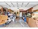 Cluttered garage with boxes, furniture, and storage containers, offering ample storage space at 28136 Tammi Dr, Tavares, FL 32778