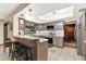 Modern kitchen with updated stainless steel appliances, granite countertops, and stylish tile flooring at 28136 Tammi Dr, Tavares, FL 32778