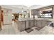 Stylish kitchen with granite countertops, stainless steel appliances, and an open view to the living room at 28136 Tammi Dr, Tavares, FL 32778