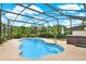Inviting private pool with a screened enclosure and a lush green backyard at 28136 Tammi Dr, Tavares, FL 32778