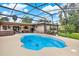 Sparkling blue pool inside screened enclosure, perfect for relaxing and entertaining in a private backyard oasis at 28136 Tammi Dr, Tavares, FL 32778