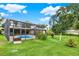 The backyard featuring a screened-in pool area, creating a private and enjoyable outdoor oasis at 28136 Tammi Dr, Tavares, FL 32778