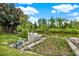 Waterfront property with private dock and boat lift with lush foliage enhancing its private, secluded location at 28136 Tammi Dr, Tavares, FL 32778