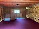 Upper level/attic featuring wooden beams, a window, and ample storage space at 3064 S Us Highway 41, Dunnellon, FL 34432