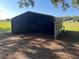 Open barn structure with a metal roof offers shelter and storage in a rural setting at 3064 S Us Highway 41, Dunnellon, FL 34432