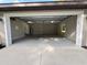 Spacious garage with high ceilings, bright lighting, wash sink, and a side window for natural light at 3064 S Us Highway 41, Dunnellon, FL 34432