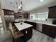 Gourmet kitchen with stainless steel appliances, granite countertops, and a center island with seating at 3064 S Us Highway 41, Dunnellon, FL 34432