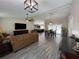Open-concept living room and dining area with modern finishes and plenty of natural light at 3064 S Us Highway 41, Dunnellon, FL 34432