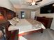 Comfortable main bedroom offers a tray ceiling, plush carpet, and a serene atmosphere for relaxation at 3064 S Us Highway 41, Dunnellon, FL 34432