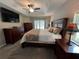 The main bedroom features a tray ceiling, private access to the pool, and an en-suite bathroom at 3064 S Us Highway 41, Dunnellon, FL 34432
