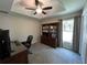 The home office offers privacy and functionality with a built-in bookcase and natural light from the window at 3064 S Us Highway 41, Dunnellon, FL 34432