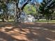 Exterior view of a metal outbuilding on a treed lot, offering ample space at 3064 S Us Highway 41, Dunnellon, FL 34432
