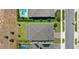 Aerial view showcasing rooftops, driveways, and the surrounding greenery in the community at 3294 Hanging Tide St, Winter Garden, FL 34787